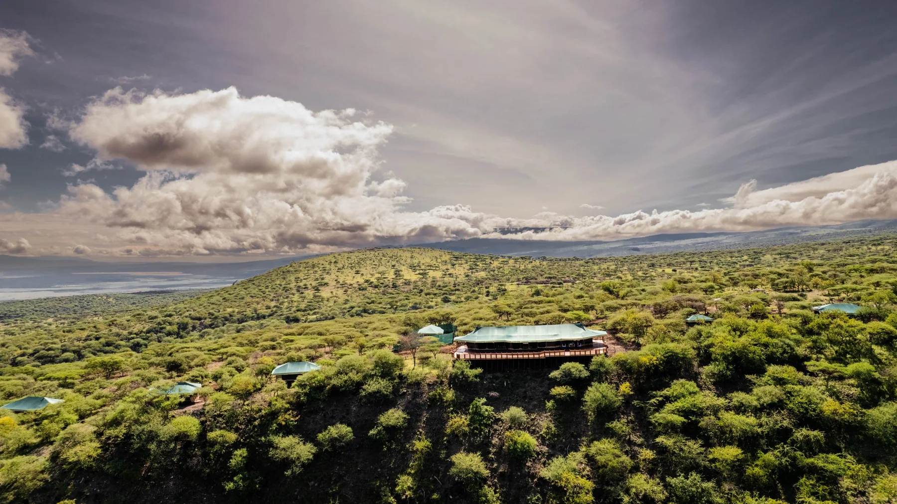 Camp and surrounding green landscape at Embalakai Ngorongoro Camp