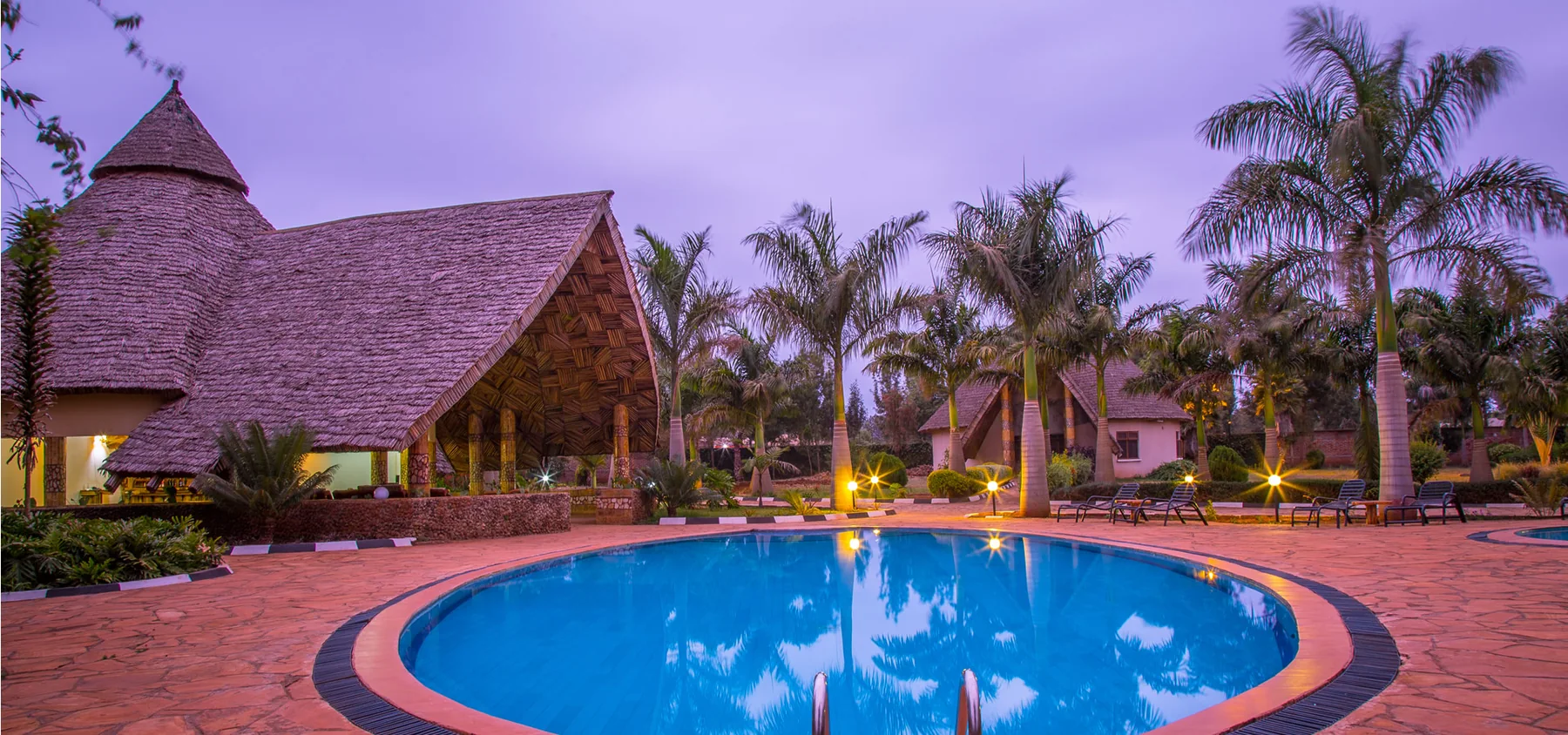 Swimming pool at Farm of Dreams Lodge at dusk